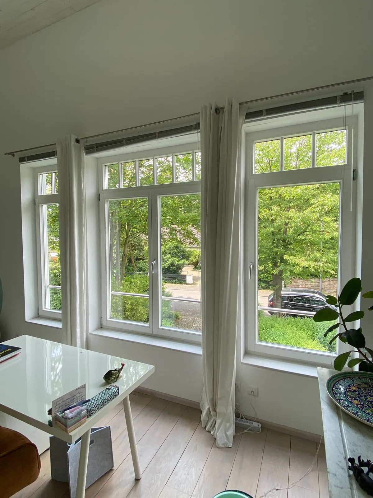 White home windows overlooking a garden